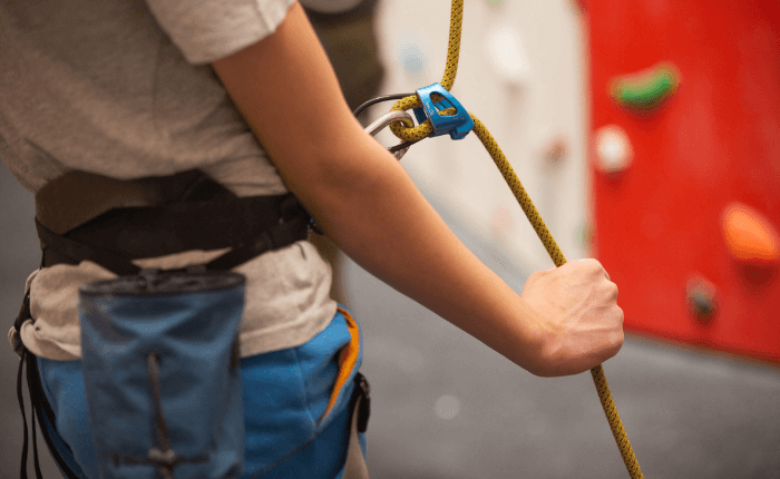 close up of the arms of someone belaying