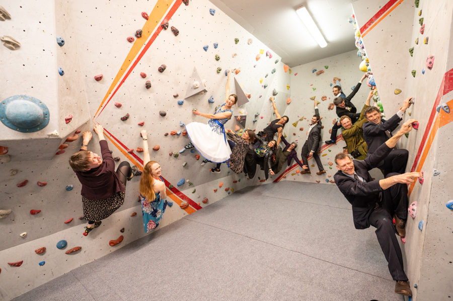 all of the guests on the bouldering wall