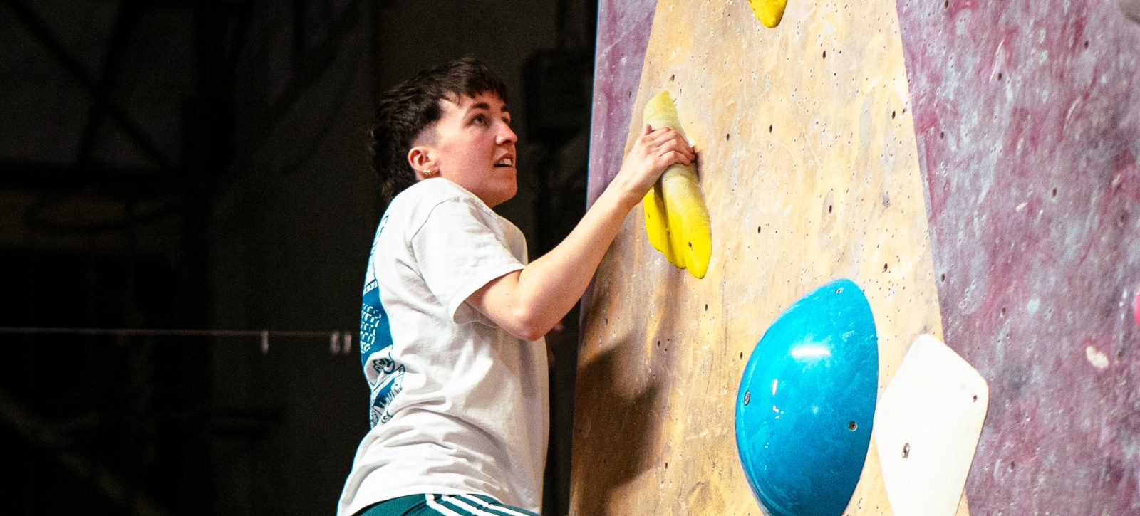 Person climbing at Queer Climbing Social at TCA