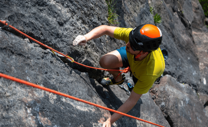 A climber on an outdoor trad route